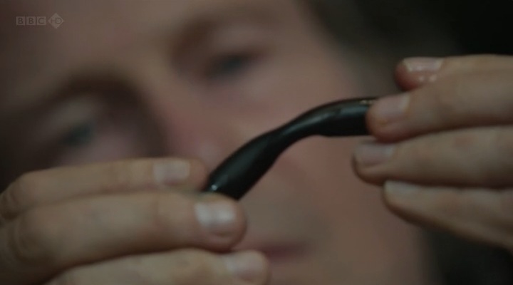 Richard Feynman shows a deformed O-ring from a space shuttle solid rocket booster, in the BBC's "Challenger" dramatisation.