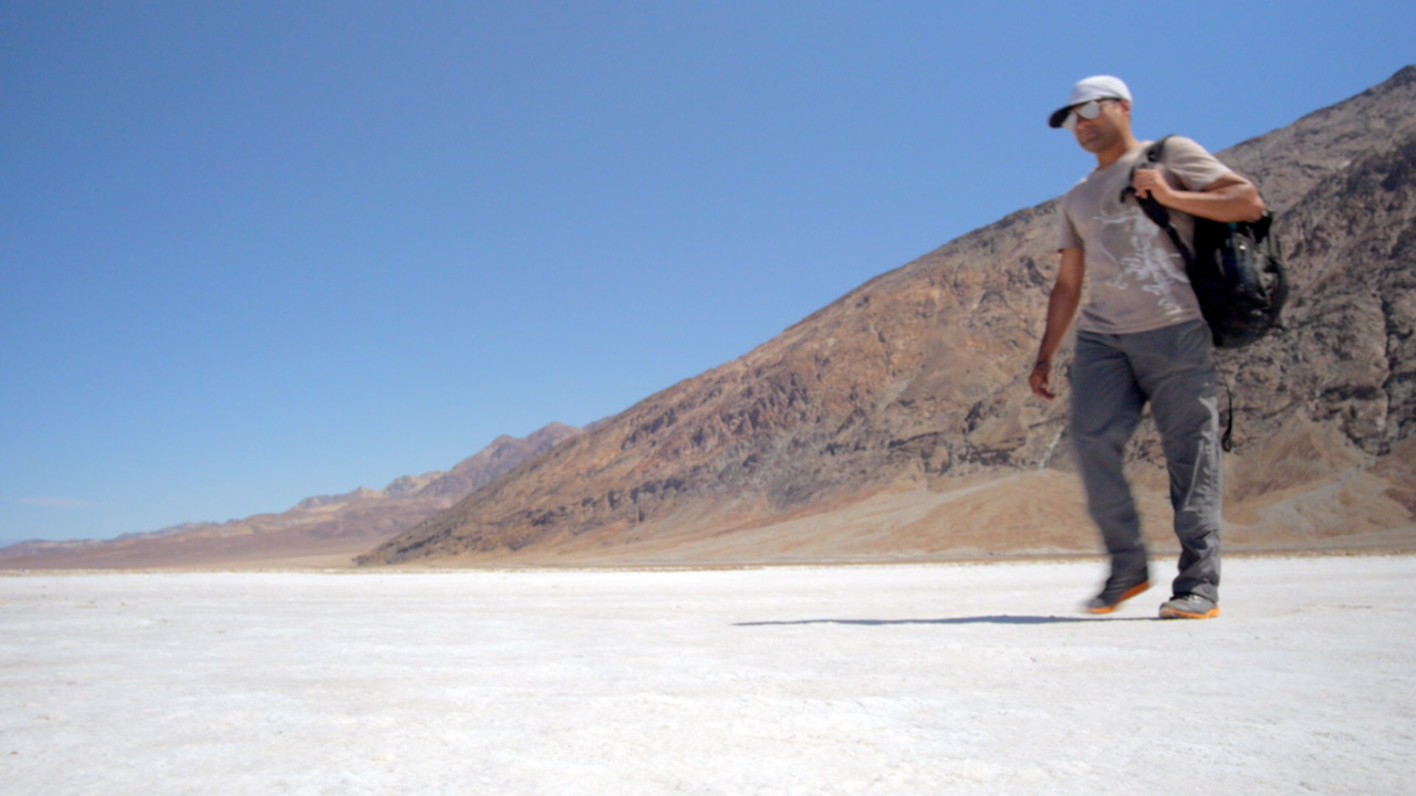 Alom strides out across the salt crust at Badwater Basin